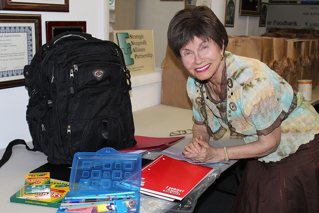 Gloria Max shows some of the supplies that are included in the high quality backpack. Photo by Jacque Estes