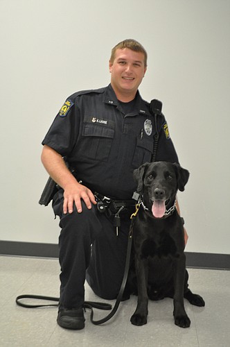 OBPD K-9 Officer Keaton Labrie smiles with Rex. Photo by Jarleene Almenas.