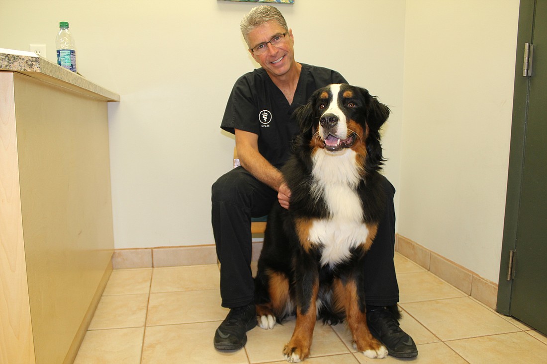 Dr.  Kelly Long and his 1-year-old dog Gunnison. Long helps pet owners in HospiceCare ensure thier pets are well cared for. Photo by Jacque Estes