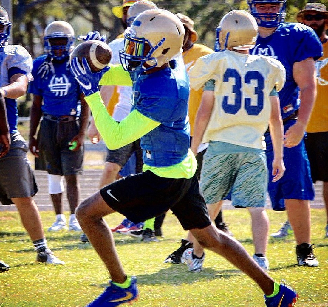 Nathaniel Dell snags a pass during the first week of Mainland's fall practices. Courtesy: Mainland Athletics