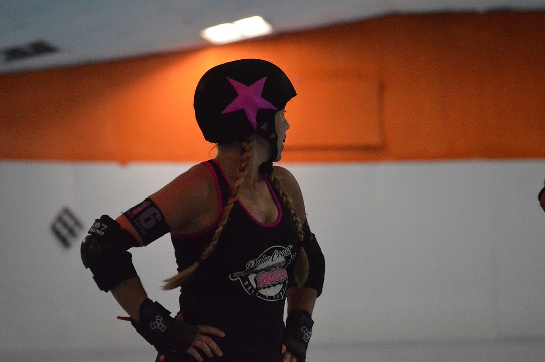 Holy Scrap, a member of the Beachside Brawlers of Palm Coast Roller Derby plays the role of the jammer during Sunday's game against the Jacksonville J-Villains.
