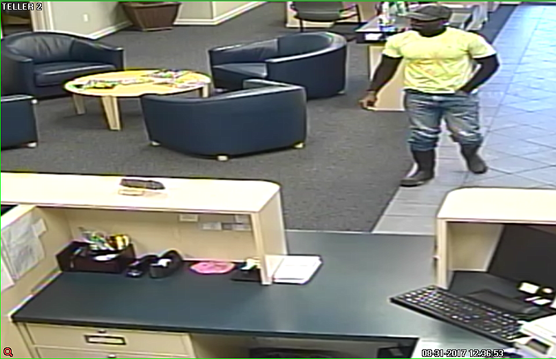 Security cam footage of the Friends Bank robbery suspect.