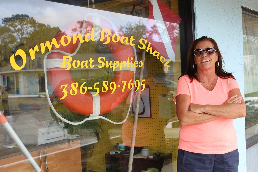 Lorraine Hughey stands in front of her new business, Ormond Boat Shack, at the plaza located on 600 S. Yonge St. Photo by Jarleene Almenas