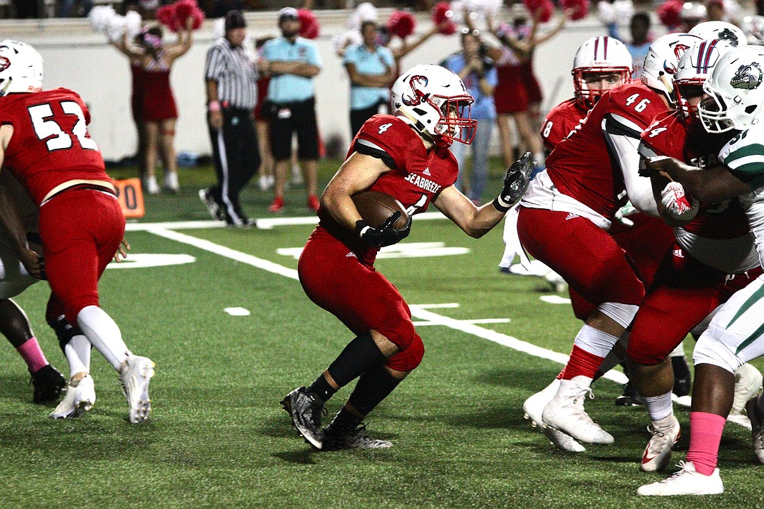 Seabreeze running back Zach McNeely runs with the ball in a game against Flagler Palm Coast. Photo by Ray Boone