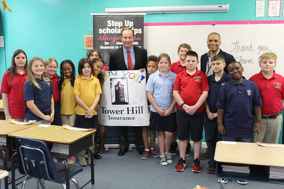 Mrs. Maser's fourth grade class is all smiles with Tower Hill President Don Matz and Calvary Christian Academy Headmaster Aaron Gonzalez on Wednesday, Oct. 25. Photo by Jarleene Almenas
