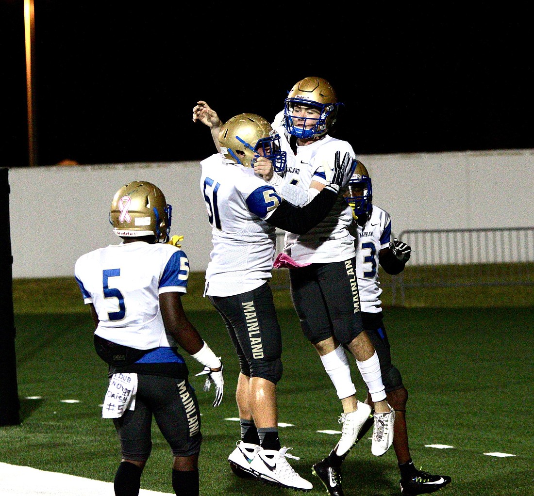 Mainland players celebrate after scoring a touchdown against Seabreeze. Photo by Ray Boone