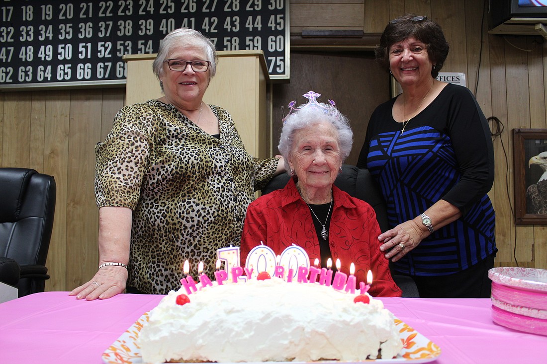 Simone Harvey, Lillian Johnson and Lucia McLoughlin celebrate Johnson's 100th birthday. Photo by Jarleene Almenas