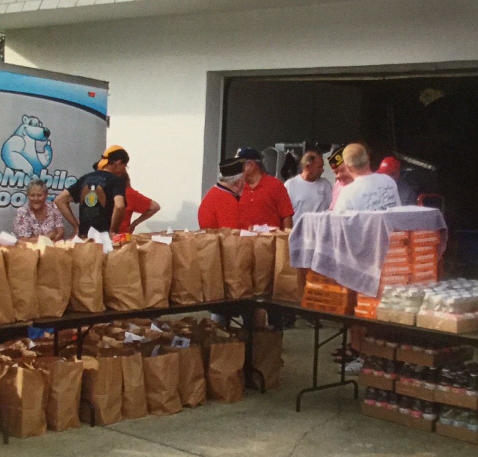 Volunteers help the Jewish Federation of Volusia and Flagler Counties with the distribution of Thanksgiving supplies for over 400 families. Photo courtesy of Joe Mickol
