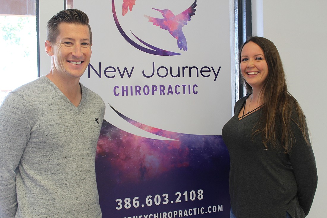 Blake and Jayme Frear smile in their new medical office space in the Trails Shopping Center. Photo by Jarleene Almenas