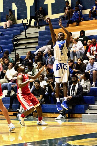 Mainland's Da'Tonio Robinson shoots a 3-pointer against Seabreeze. Photo by Ray Boone