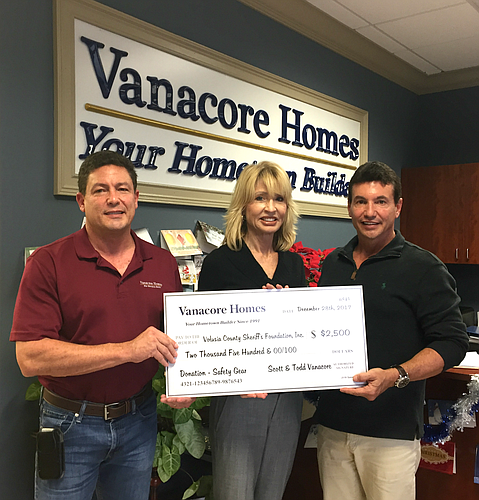 Todd and Scott Vanacore present a check to Edith Shelley, chairwoman of Volusia County Sheriff's Foundation. Courtesy photo