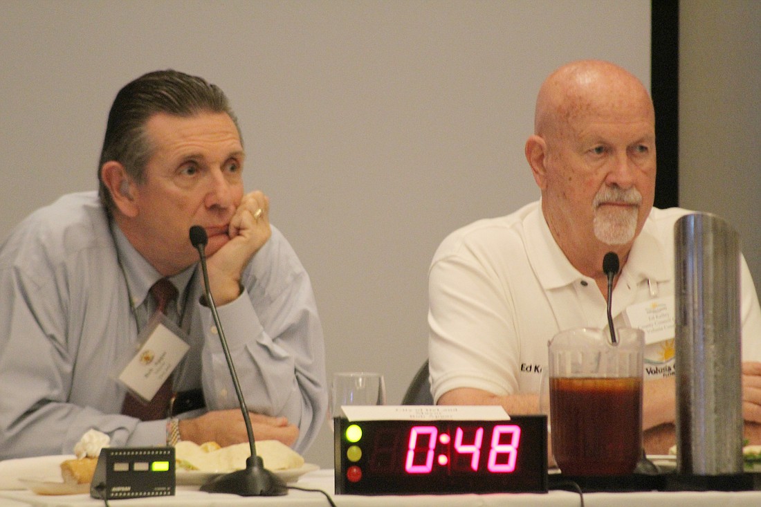 Round Table Chair and DeLand Mayor Bob Apgar and County Council Chair Ed Kelley listen to discussion during the Round Table of Volusia County Elected Officials meeting on Feb. 12. Photo by Jarleene Almenas