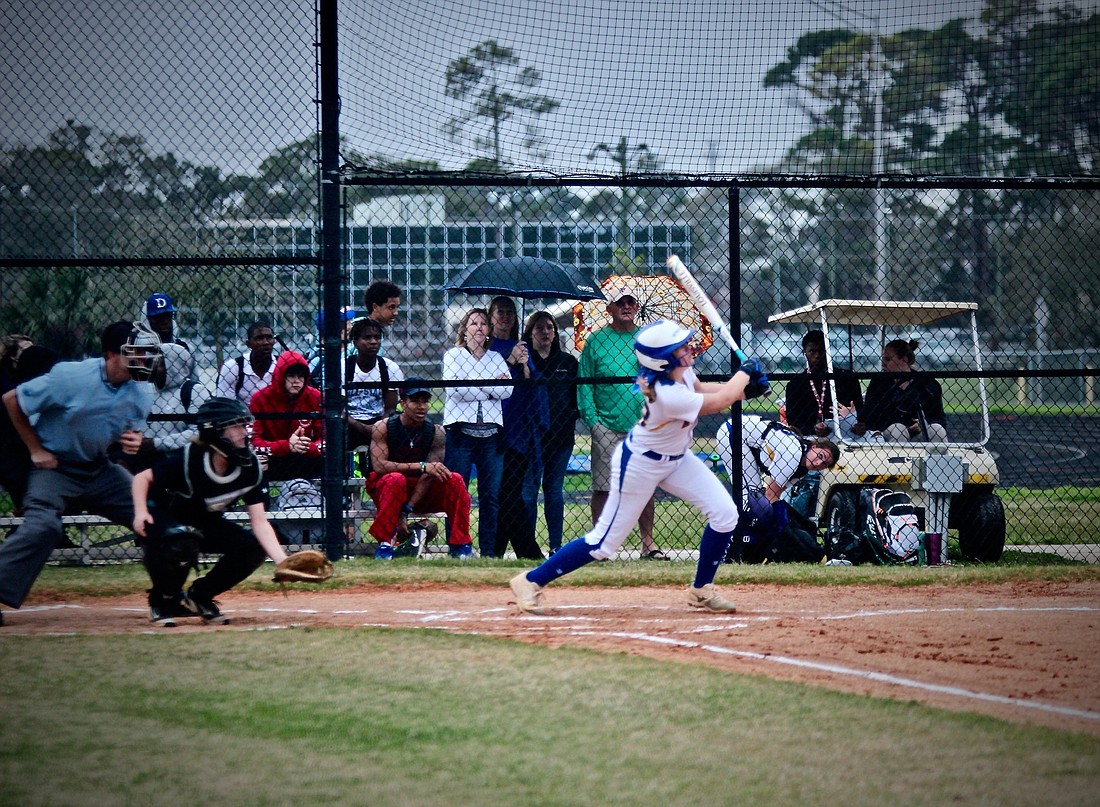 A Mainland softball player connects on a pitch against Atlantic. Photo by Ray Boone