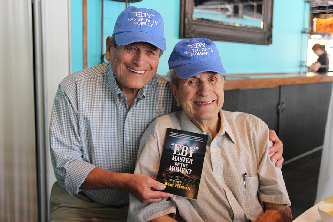 Burt Herman smiles with his book, and his lifetime hero, Guy Eby at L.A.'s Bistro on Wednesday, April 5. Photo by Jarleene Almenas