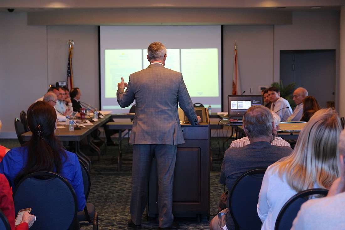 Beachside Redevelopment Director Clay Ervin walks the group through the list of final recommendations at the Daytona Beach International Airport on April 16. Photo by Jarleene Almenas
