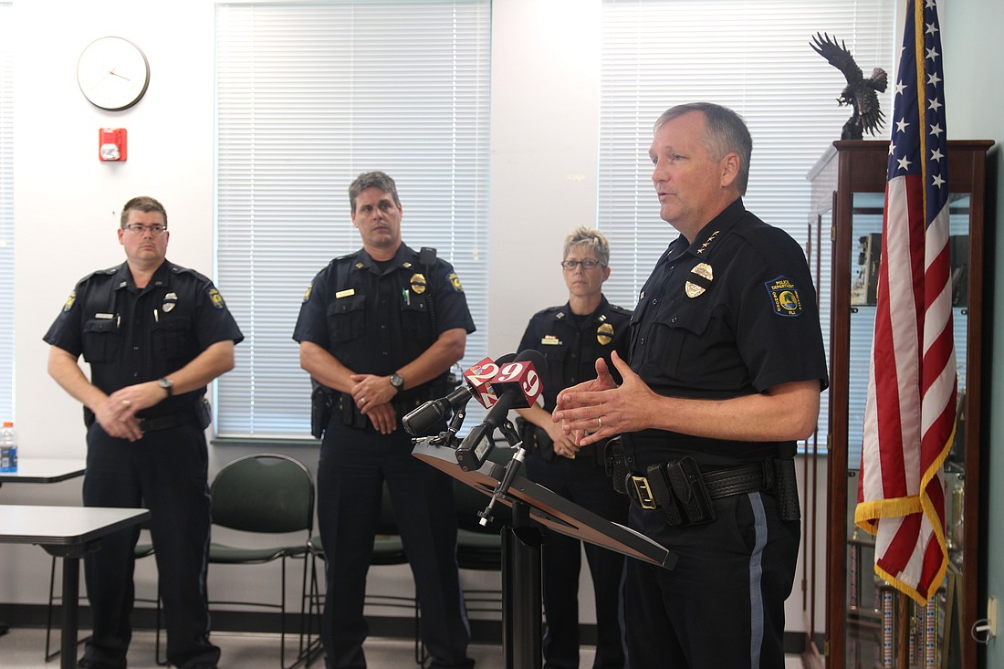 OBPD Chief Jesse Godfrey talks about the internal investigation as Public Information Officer Keith Walker, Capt. Chris Roos and Capt. Lisa Rosenthal stand by. Photo by Jarleene Almenas