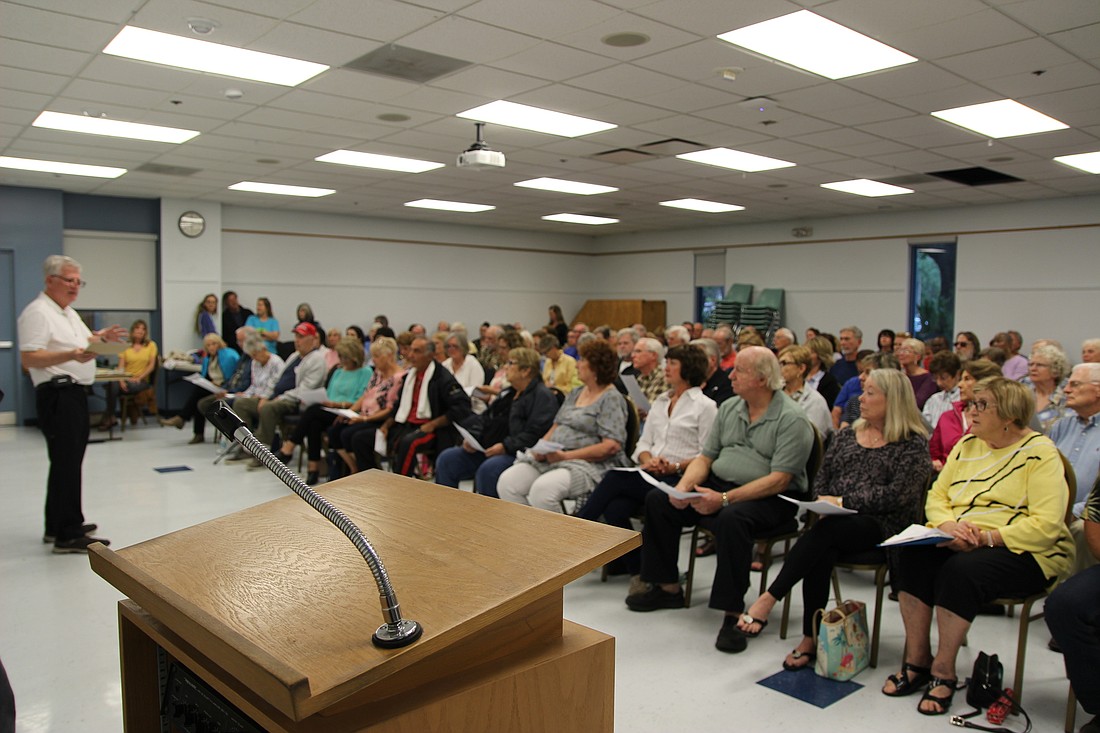 Jeff Boyle speaks to a crowd at a recent CANDO 2 meeting. File photo by Jarleene Almenas