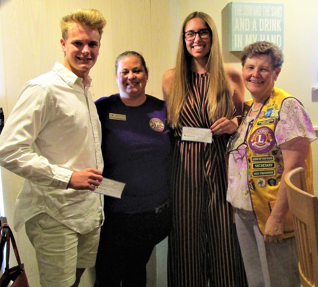 Scholarship winner Grant Wichlei, Scholarship Committee Chair Chasity Dietlin, scholarship winner Mary Roth and Lions Club President Bobbie Cheh. Courtesy photo
