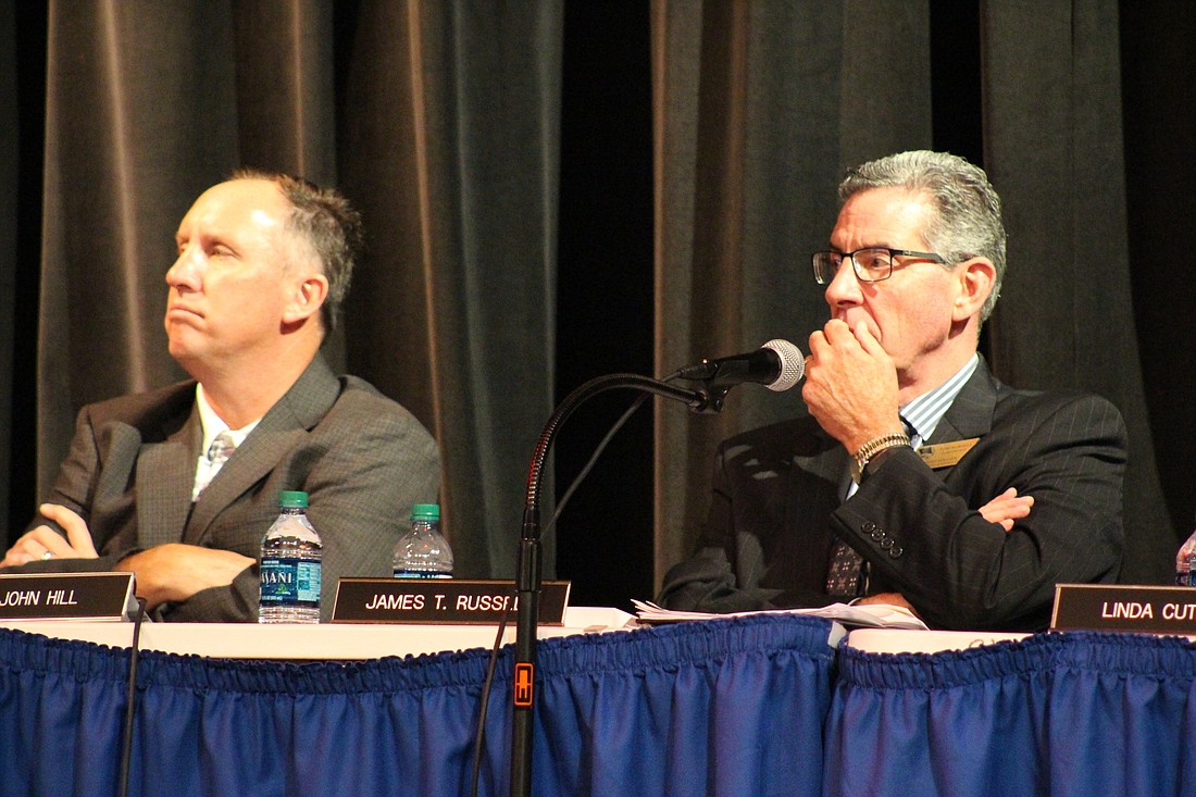 Volusia County School Board Vice Chairman Dr. John Hill and School Superintendent Tom Russell listen to the outline of the school safety plan at the meeting on Tuesday, May 22. Photo by Jarleene Almenas