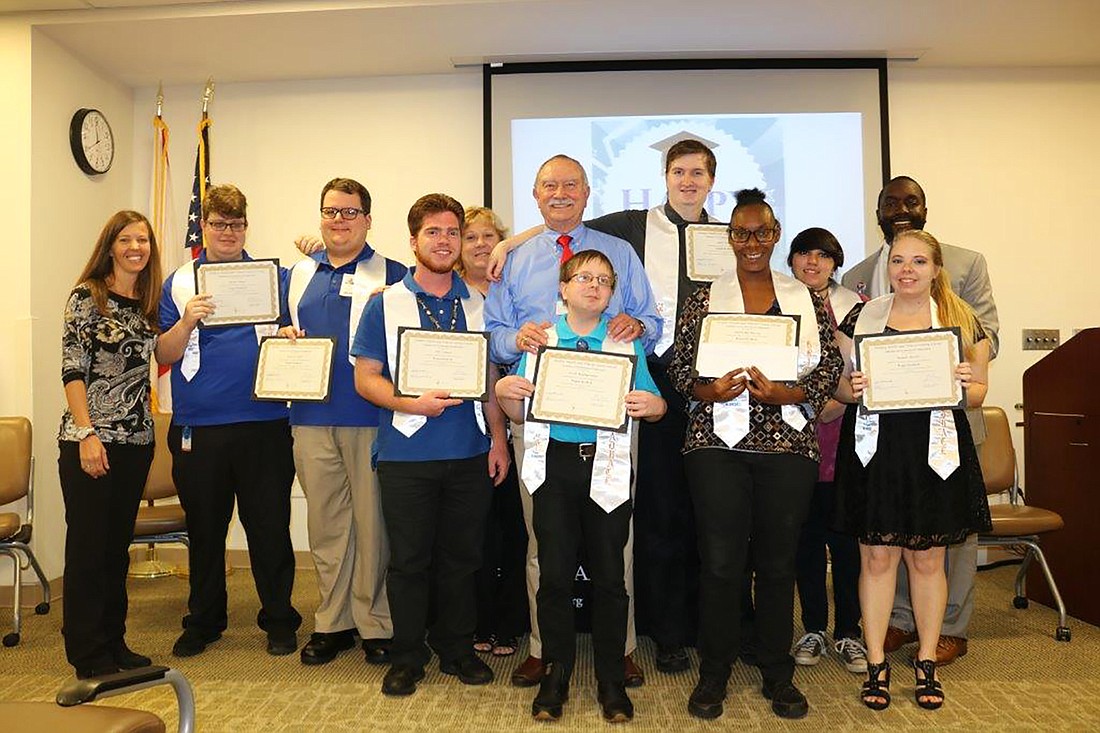 Students in the Exceptional Student Education completed a school-to-jobs program. Shown are the students along with instructors and others in Project SEARCH. Courtesy photo