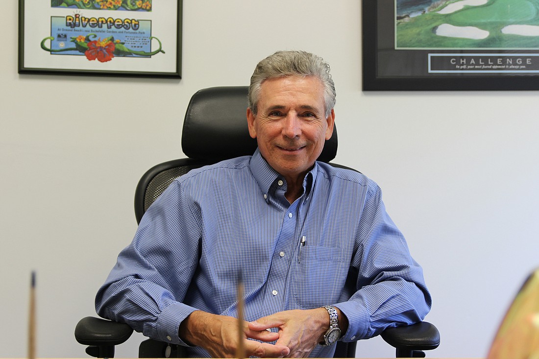 Joe Mannarino smiles in his office, days before his official retirement. Photo by Jarleene Almenas