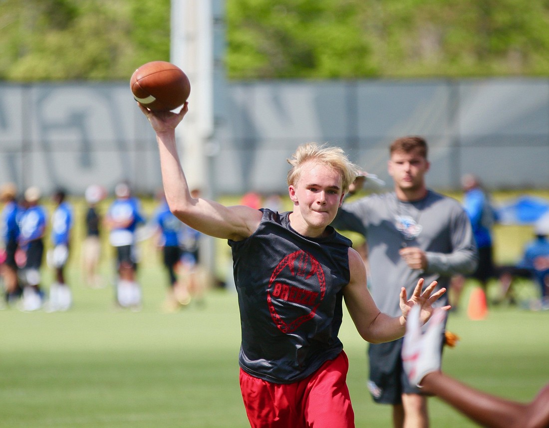 Seabreeze quarterback Isaiah Shirley throws a pass at UCF's 7-on-7 camp. Photo by Ray Boone