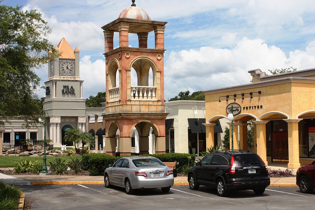 The Trails Shopping Center, now under new ownership, has Mediterranean-style architecture. Photo by Wayne Grant