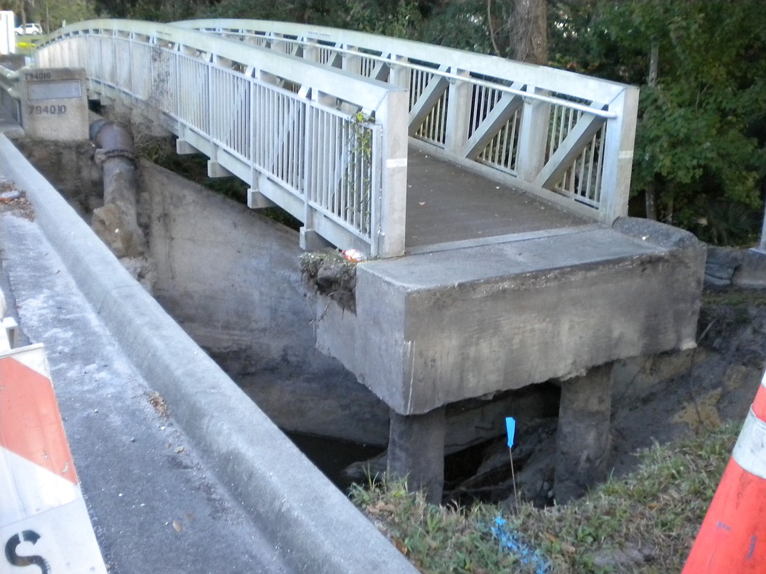 Engineers from multiple disciplines have been consulted to assess damage to bridge and roadway. Photo by Tanya Russo