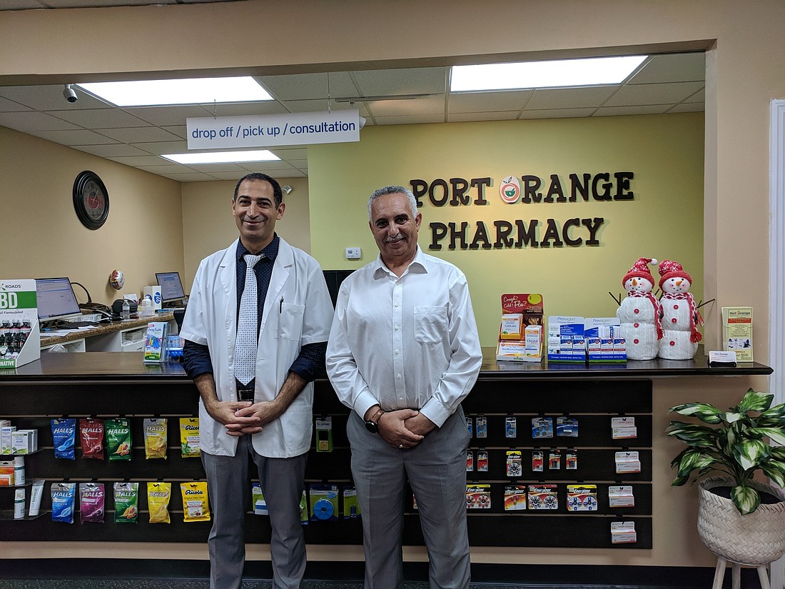 Dimetry Ghabras and Emad Kamel at the Port Orange Pharmacy. Photo by Jennifer Kirschner