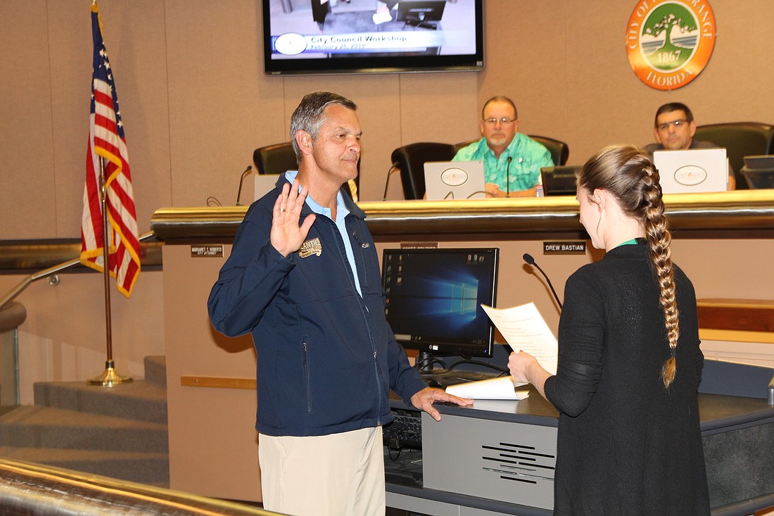 Jack Wiles, is sworn in as interim city council member for District 1. Photo by Tanya Russo