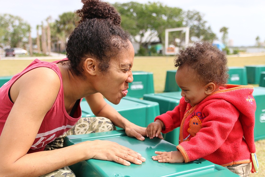 Camille and Judah Holder-Brown at last year's Earth Day celebration. File photo by Nichole Osinski