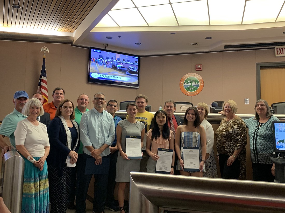 Spruce Creek High School's Envirothon team, the Advancing Glaciers, accompanied by their advisors and the City Council. Photo by Caroline Smith