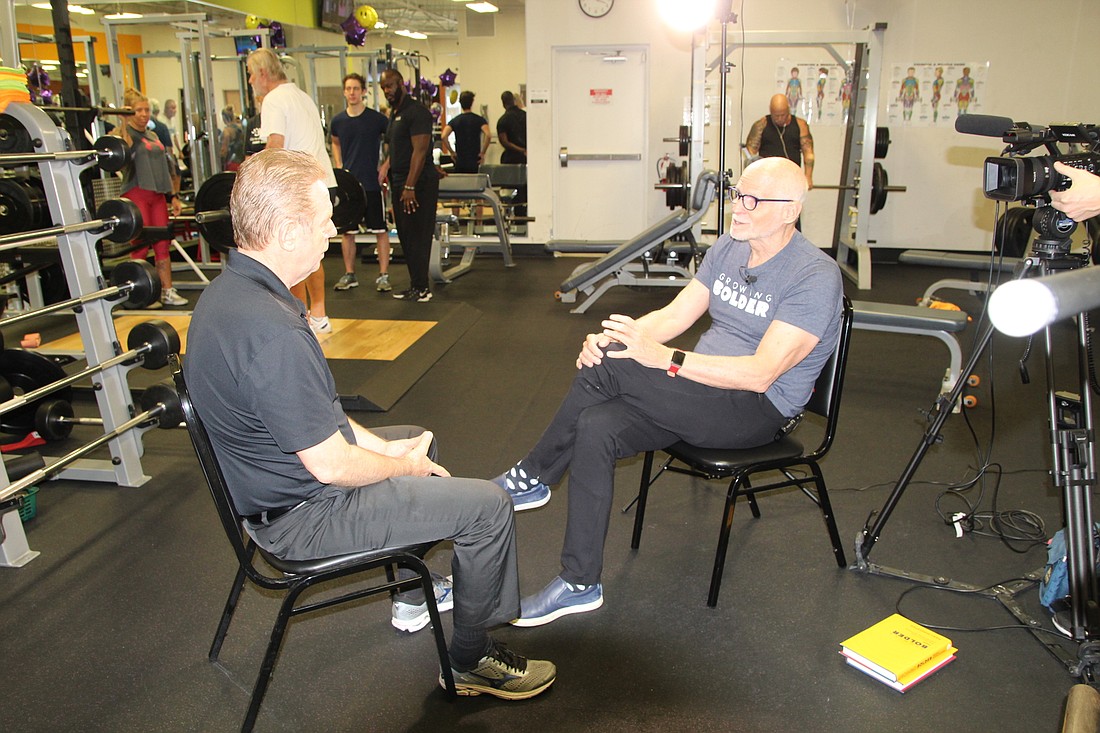 Host of the TV show on aging, "Growing Bolder," Marc Middleton interviews Anytime Fitness owner, Phil Madsen. Photo by Tanya Russo
