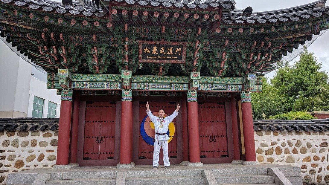 Alan Rosen stands tall as he celebrates earning first place in forms at the A Songahm Taekwondo world championship in Little Rock, AK. Photo courtesy of Alan Rosen