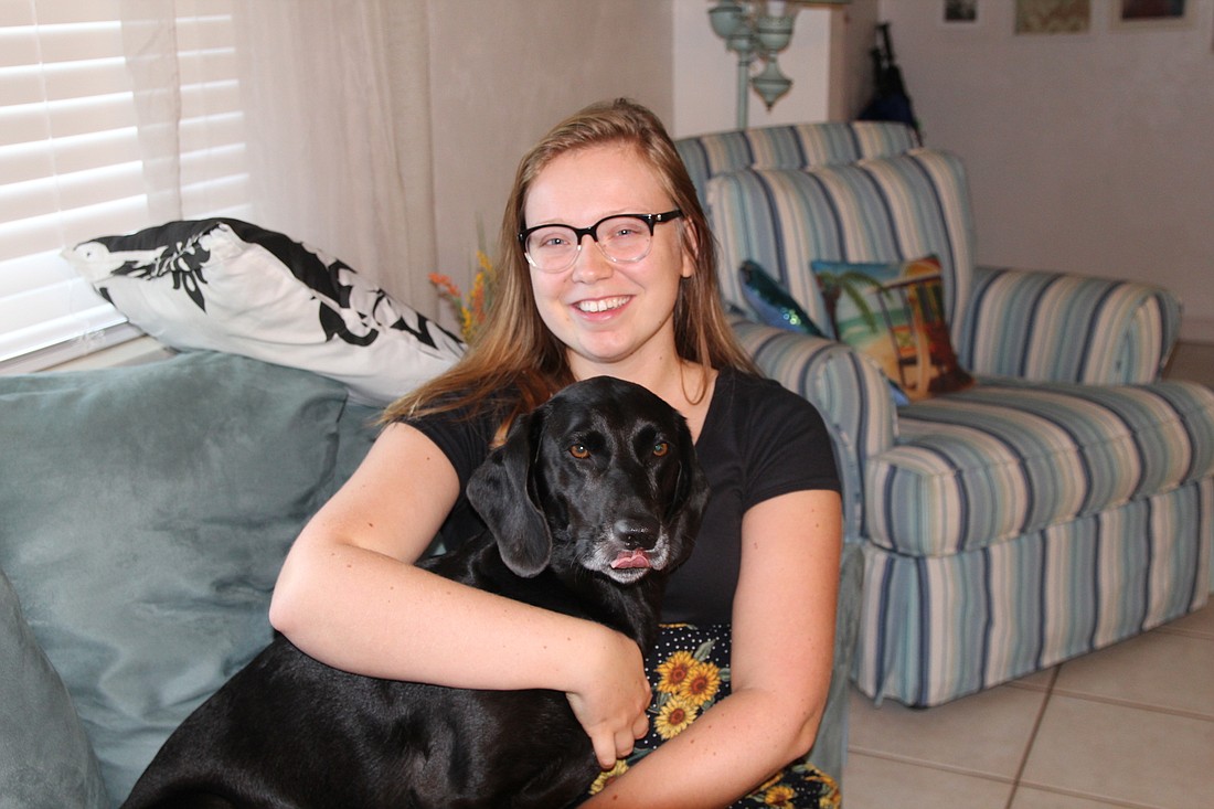 2019 National Collegiate Wheelchair Tennis champion Auburn Smith with her dog, Beau. Photo by Tanya Russo