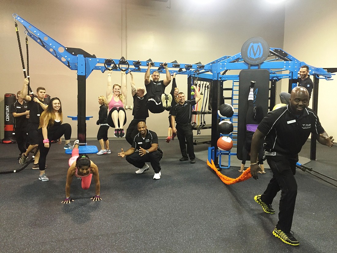 Trainers try out new equipment recently installed in the Performance Center at Gold's Gym.