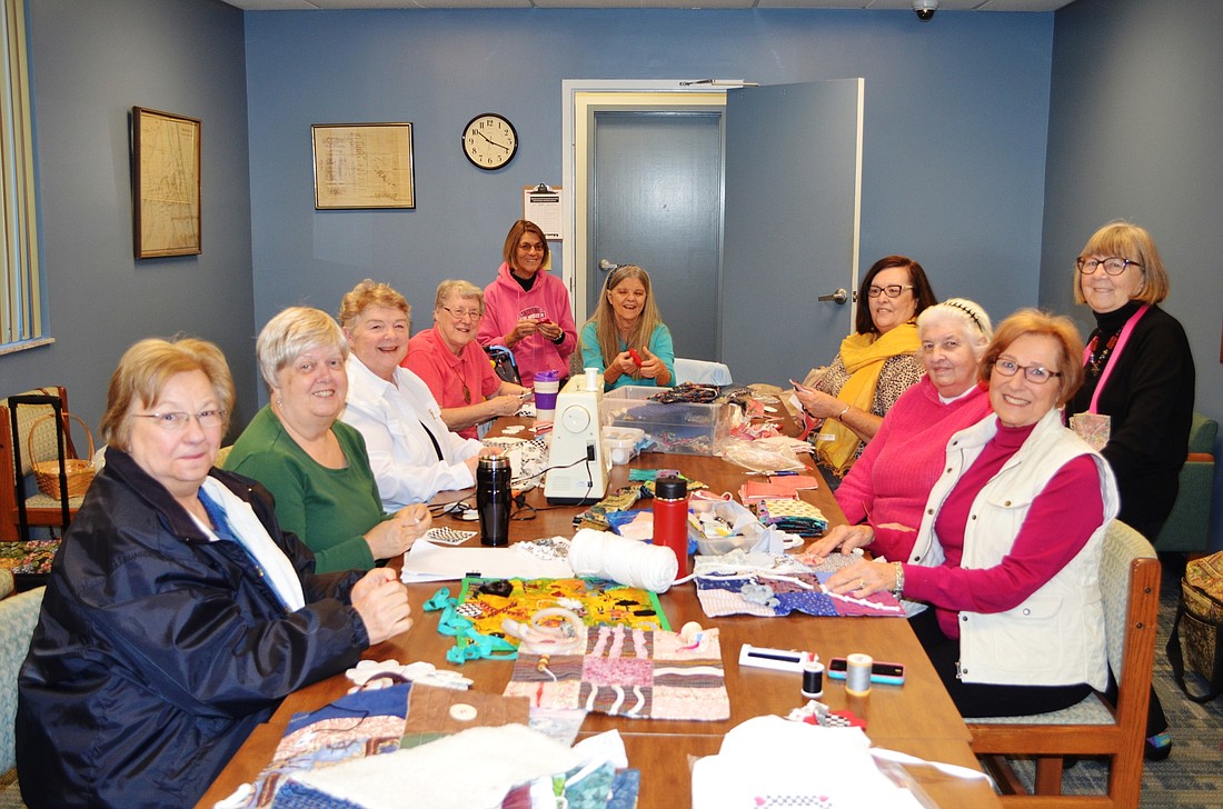 Members of Racing Fingers Quilt Guild, of Ormond Beach, include Joanna Breton, Linda Derryberry, Susan Sauro, Marian Huey, Deanna DeLeeuw, Diane Hageman, Dee Duckworth, Marianne Pitts, Liz Hall (standing) and Jean Roth.