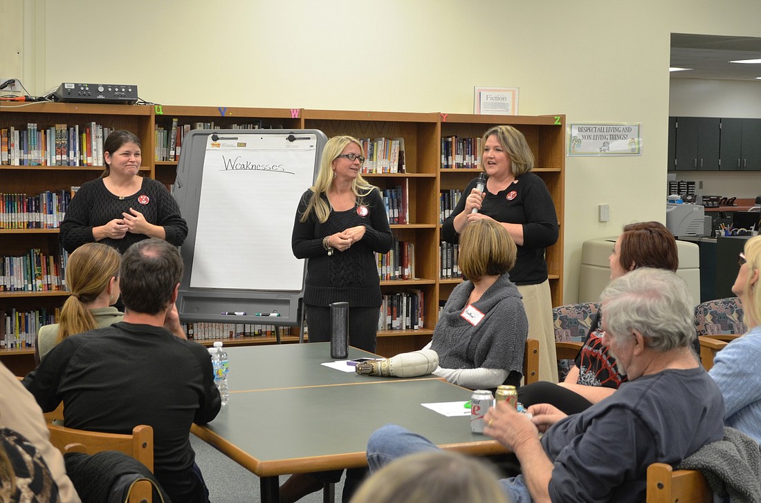 Joanna Kaney Olivari, Kim Short and Leslie LaRue lead a town hall meeting for parents and teachers.Photo by Wayne Grant