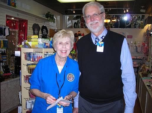 Juanita Poffenbarger and Halifax Health Auxiliary Gift Shop Manager Paul ThompsonCourtesy photo