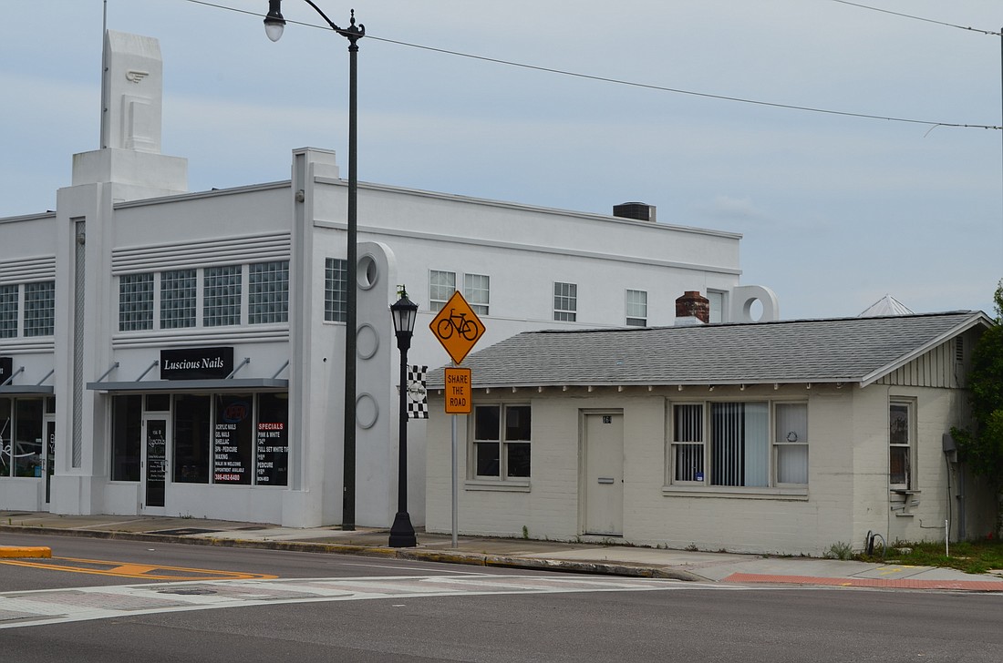 The former HUM building, shown at right, will be replaced with a new building. File photo