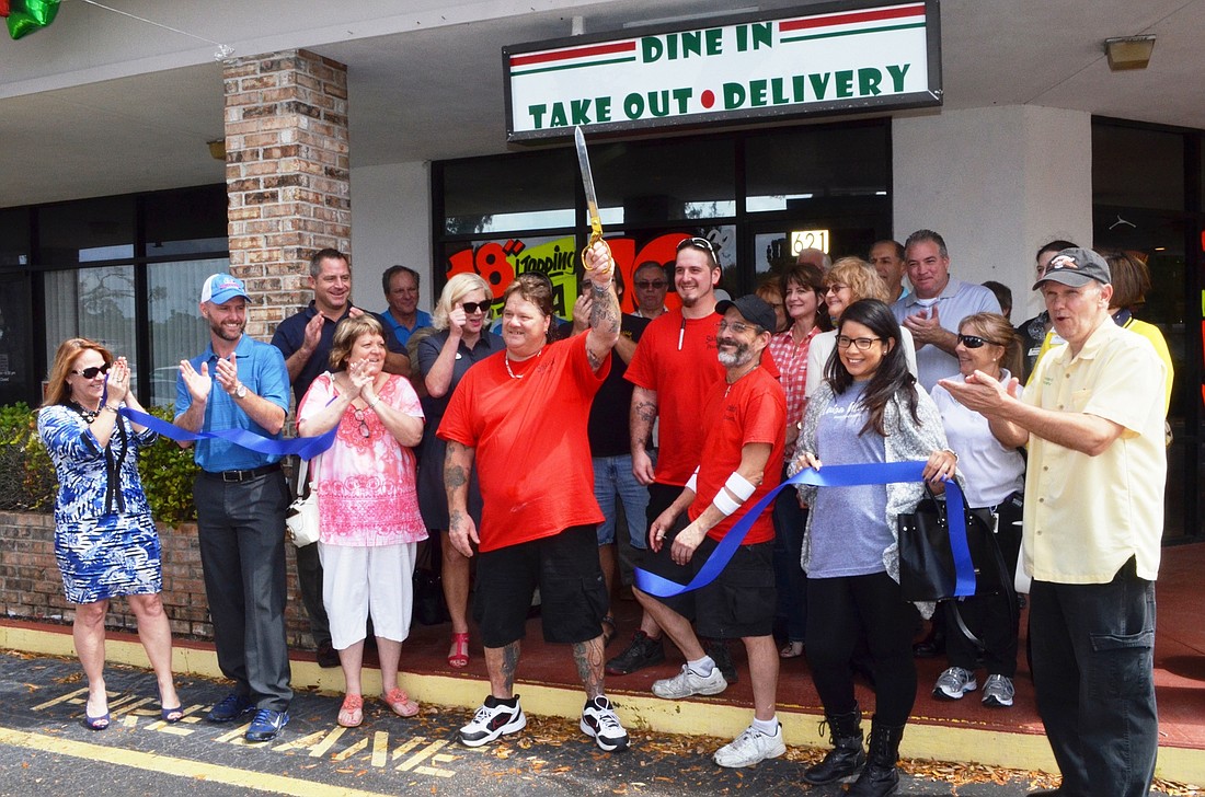 The Chamber of Commerce had a ribbon cutting for Saldo's Pizzeria on March 24. In the front row are Caryn Baker, Tom Caffrey, Eileen Needham, Owner Steve Saldo (holding scissors), his son Shawn Saldo, employee Sammy Caton, Luisa Alvarez and Don Howard.Ph