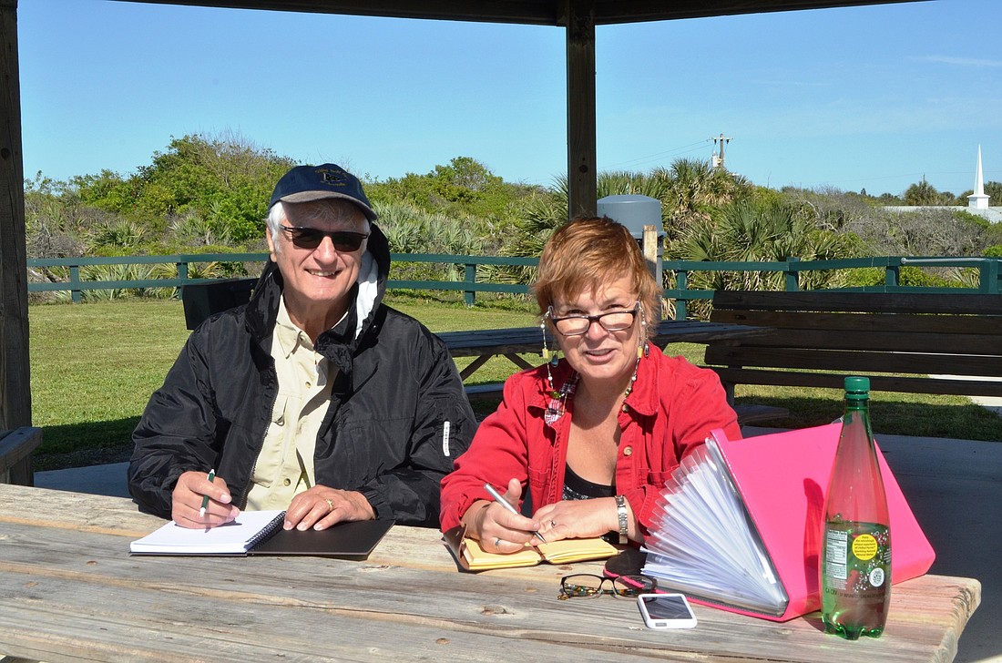 Mark Hayes, of Palm Coast, takes a writing lesson from Lorraine Berry at Bicentennial Park in Ormond-by-the-Sea.Photo by Wayne Grant
