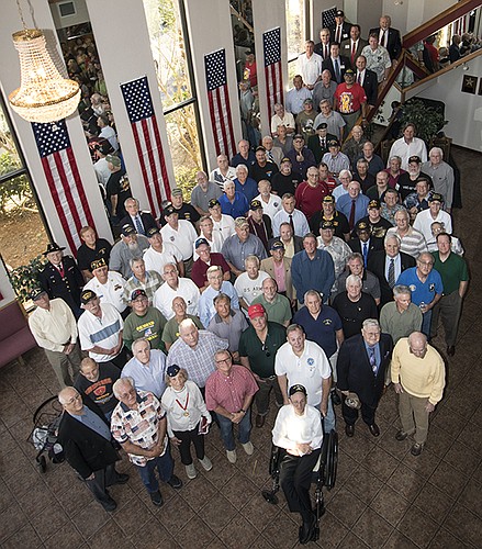 Vietnam Era veterans pose for a photo after a ceremony in their honor.Courtesy photo