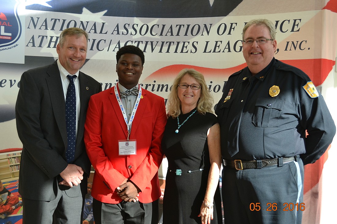 Ormond Beach Police Chief Robert Godfrey, Cameron Walden, PAL Recreation Leader Belinda Legut and Captain James Crimins are shown at the event in Tampa where Walden received the National Association PAL. Male Youth of the Year Award for 2016.Courtesy pho