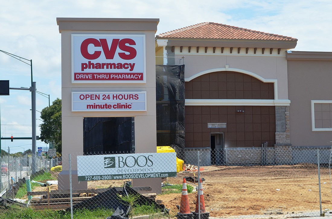 The sign says 'open 24 hours' but construction is still going on at the CVS  on West Granada Boulevard.Photos by Wayne Grant