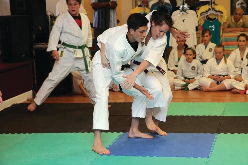 Janelle Codianne as a purple belt moving into one of her famous throws (Courtesy photos).