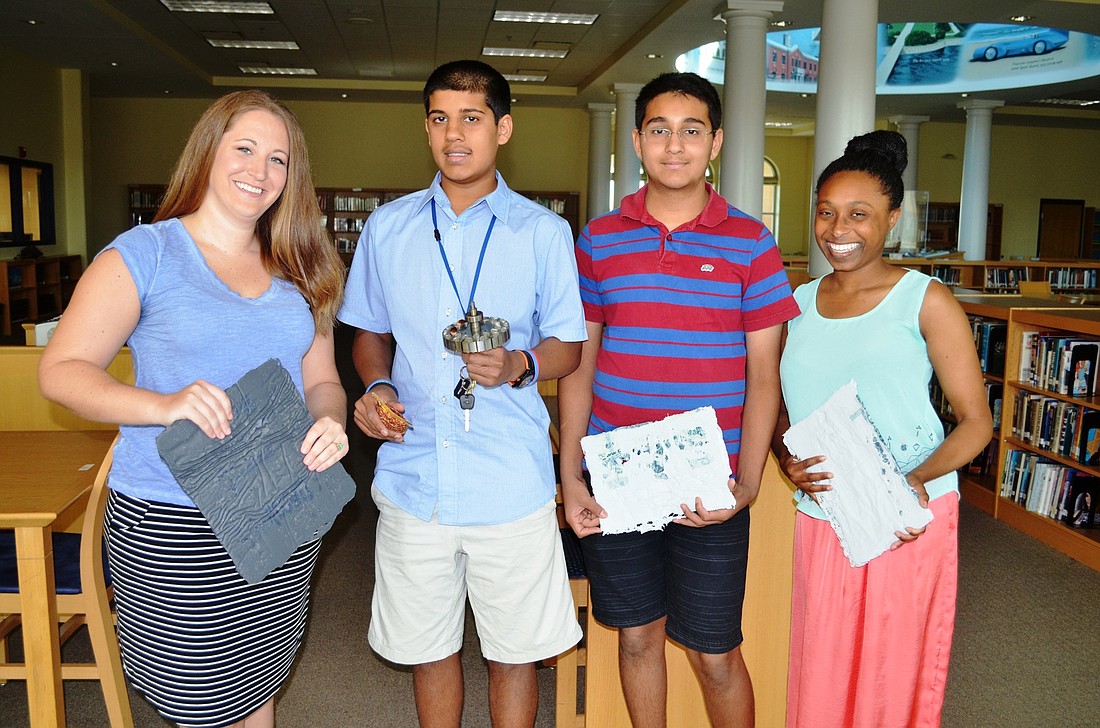 Shown with some of the parts they need for their science project are Joy Harper, Miraj Patel, Jash Patel and Deonce Roland.Photo by Wayne Grant