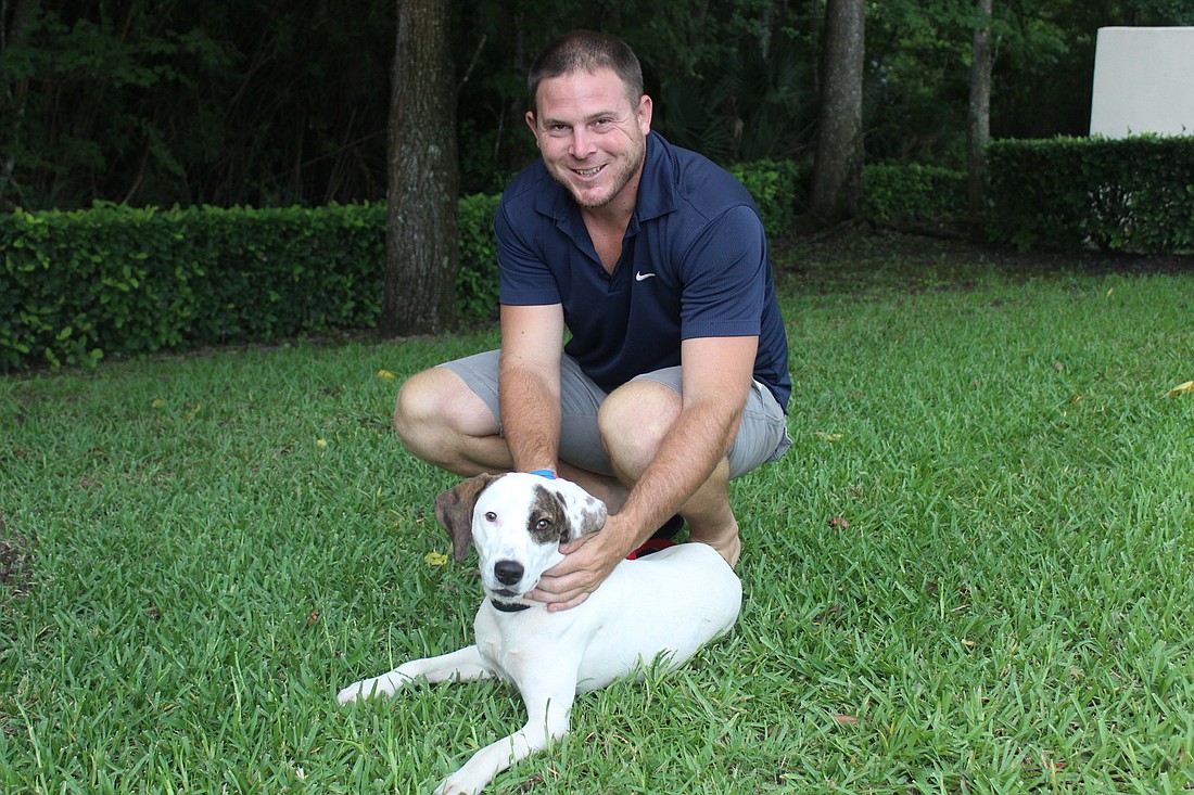 Chris Walls and his wonder dog, Chewy (Photo by Emily Blackwood)