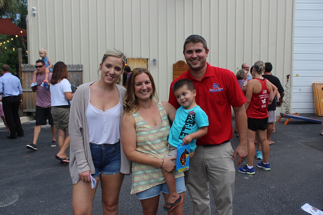 Madeline Carduner, Stephanie Renick, Thomas Renick and Tyler Renick were just a few of the many who came to support Ormond Brewing Company June 28 (Photo by Emily Blackwood).