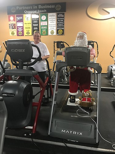 Beth Robins and her new workout buddy, Santa Claus (Photo by Emily Blackwood).